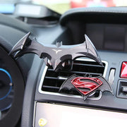 Eprolo Batman Gravity Buckle Car Phone Holder alongside a Superman holder on a car dashboard, combining iconic design with practicality.
