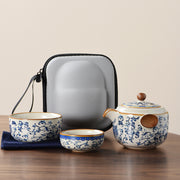 Portable Blue And White Beige Ru Kiln Travel Tea Set by eprolo, featuring a beautifully designed teapot and two cups, with a protective case and a vintage floral pattern.
