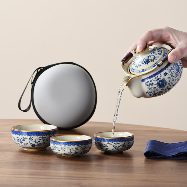Portable Blue And White Beige Ru Kiln Travel Tea Set by eprolo, highlighting the action of pouring tea from a decorated teapot into beautifully designed cups.