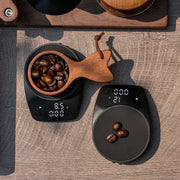 Mini Electronic Coffee Scale by eprolo weighing coffee beans in a decorative wooden bowl, ideal for perfect brewing.