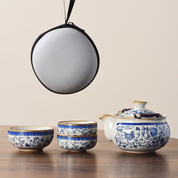 Portable Blue And White Beige Ru Kiln Travel Tea Set by eprolo, showcasing a complete set with teapot and stacked cups, elegantly patterned, ready for travel.
