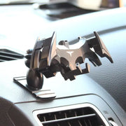 Eprolo Batman Gravity Buckle Car Phone Holder positioned on a car dashboard, designed for 4-6.5 inch devices. Perfect for easy phone navigation.