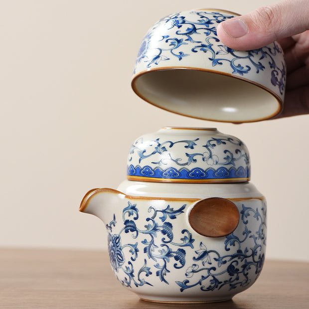 Portable Blue And White Beige Ru Kiln Travel Tea Set by eprolo, illustrating the ease of stacking the teapot and cups, featuring intricate blue floral designs.